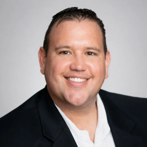 Headshot of Jason Bryan Ball, founder of Ball Political Planning and financial educator focused on public policy and economic systems.